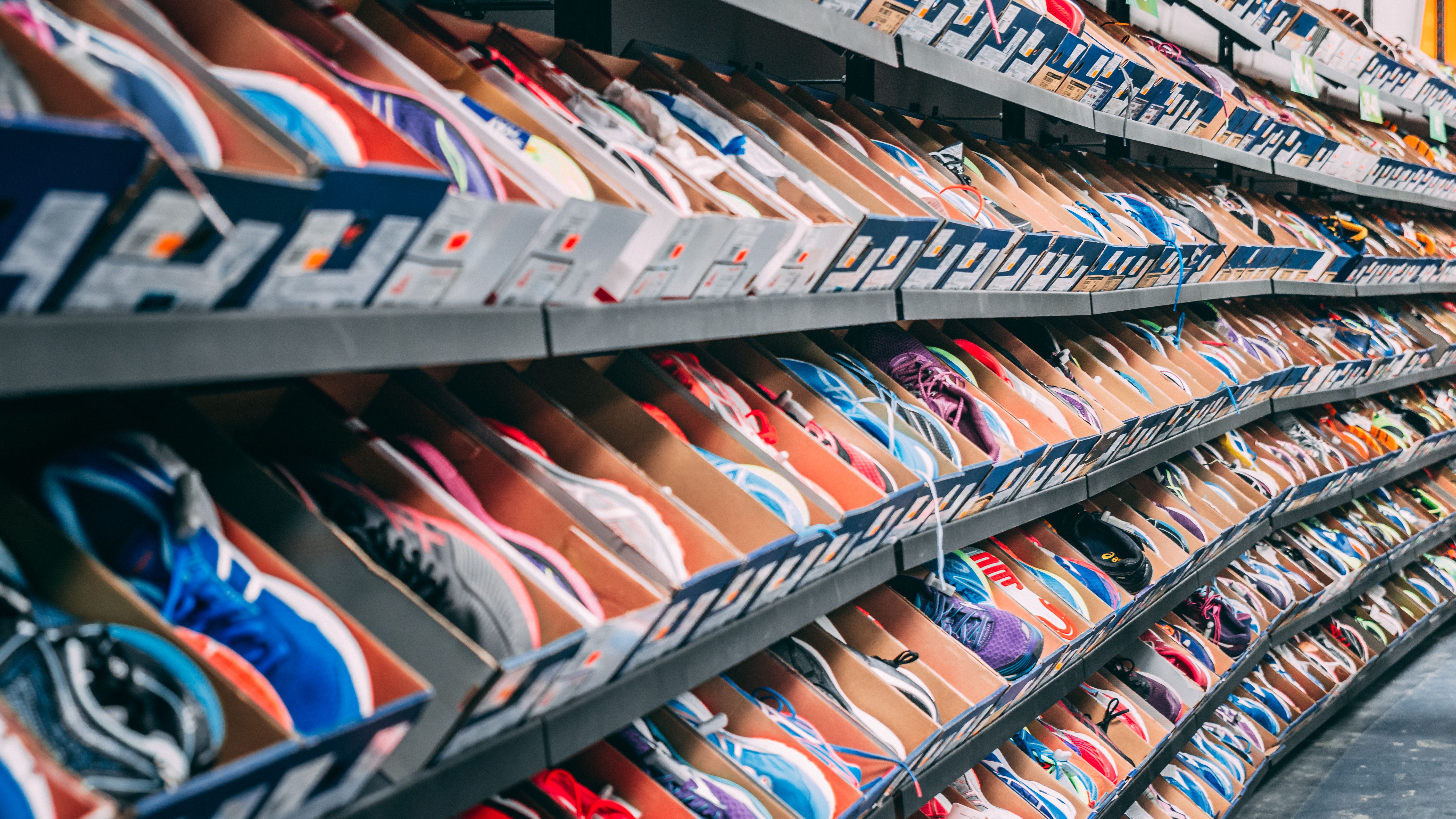 Rows of shoes on shelves in a wholesale shop